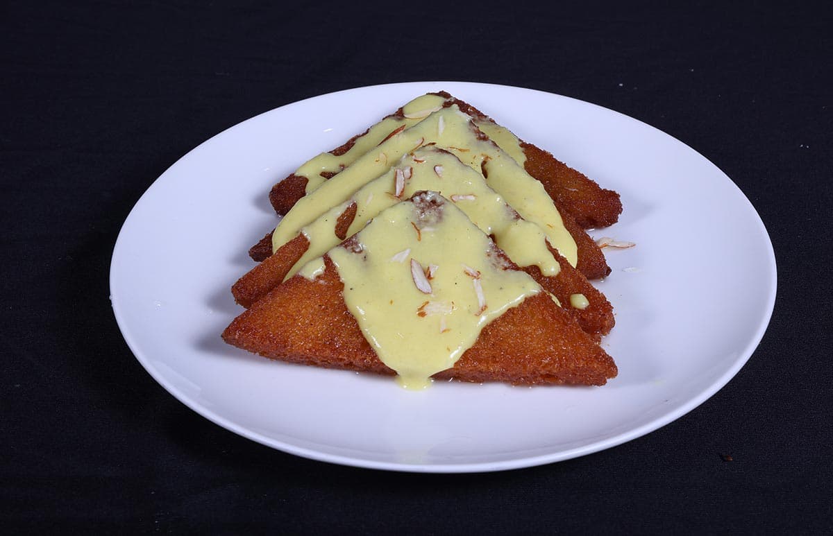 Fried dessert with custard drizzle at Foyer