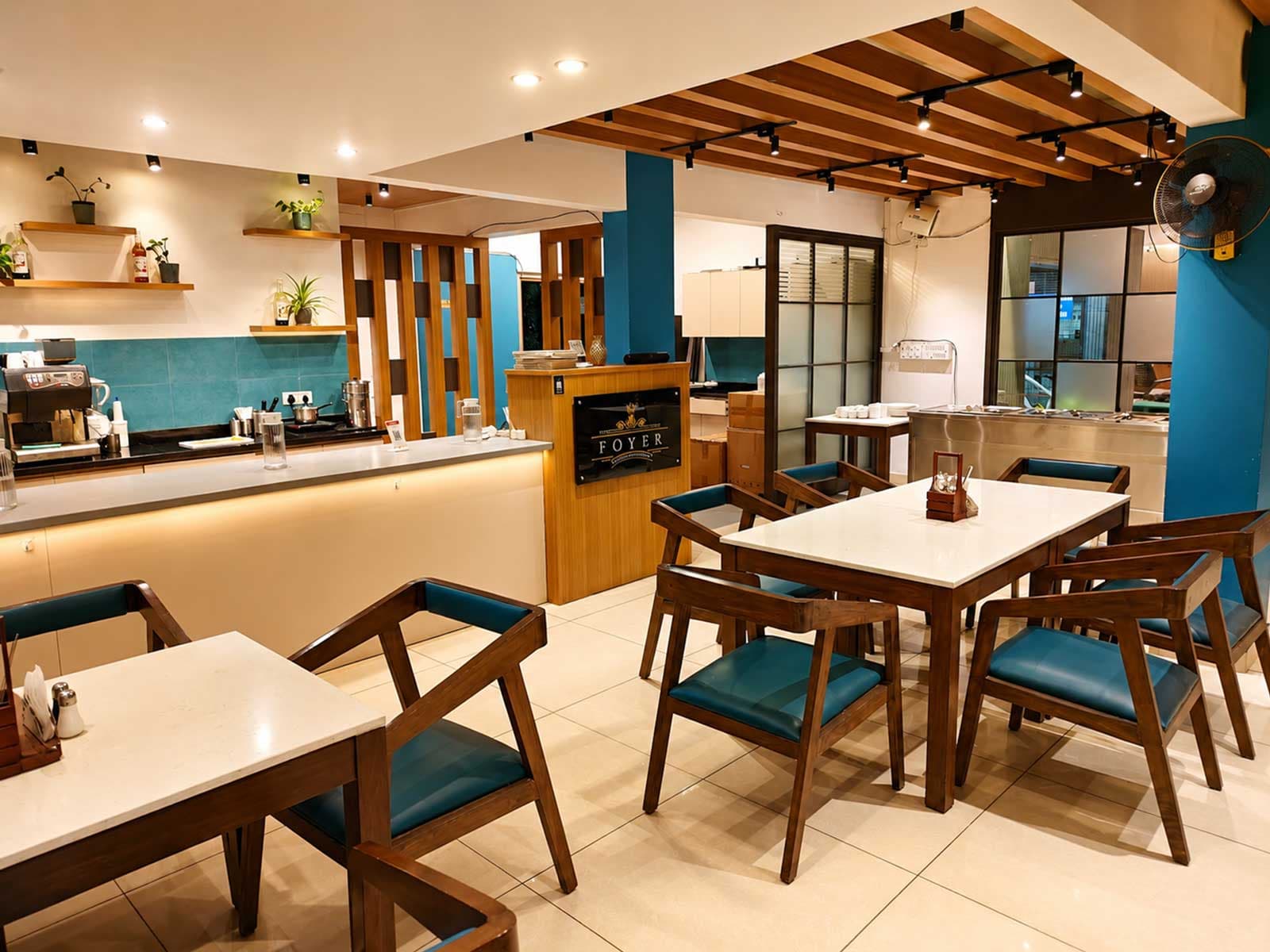 Foyer multi-cuisine restaurant kitchen counter and signage