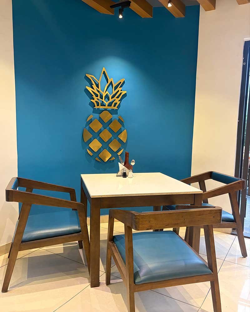 Foyer pineapple wall art table seating